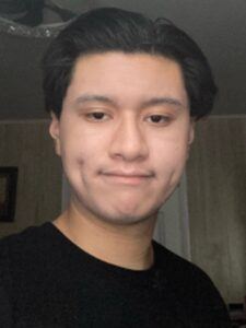 Angel Carcamo, creator of Thrive With Angel, documenting a beginner online business journey